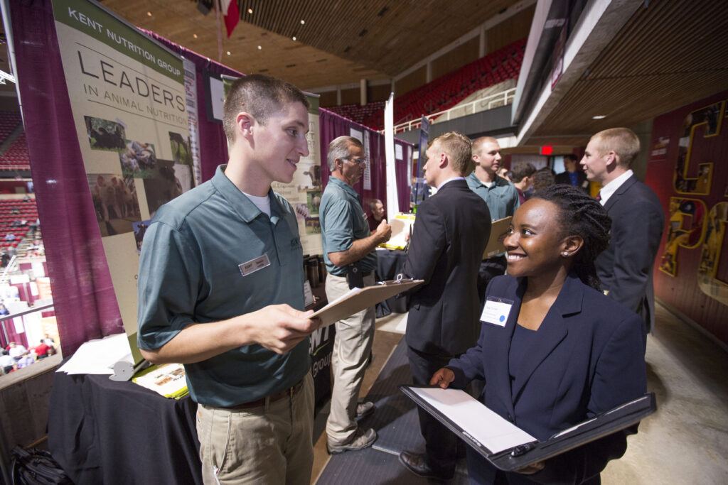 Student and Employer networking at a career fair