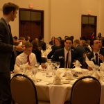 students at formal dinner