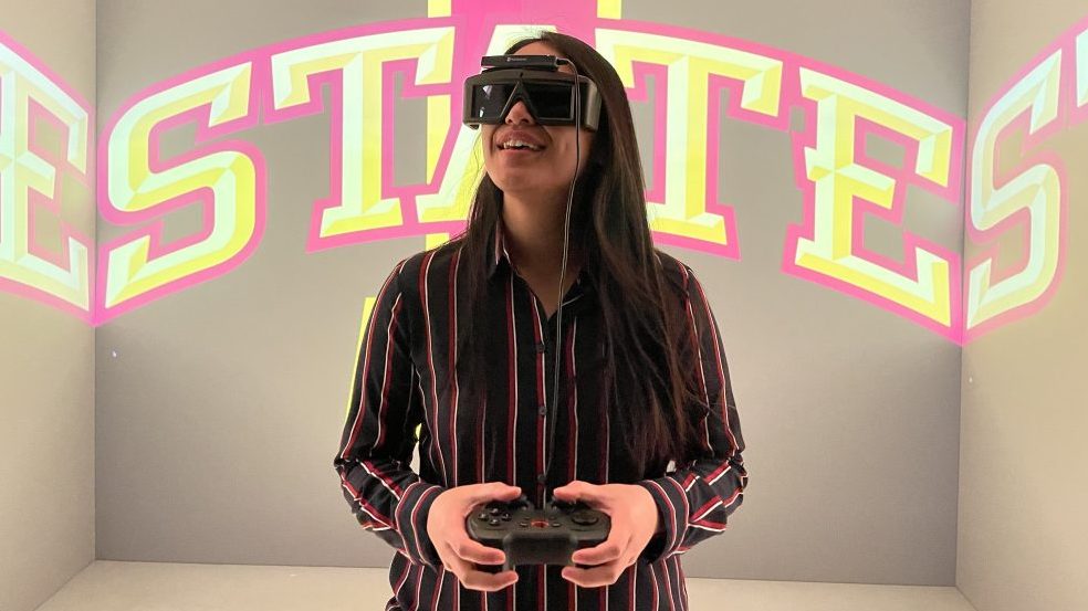 Grad student uses virtual reality goggles