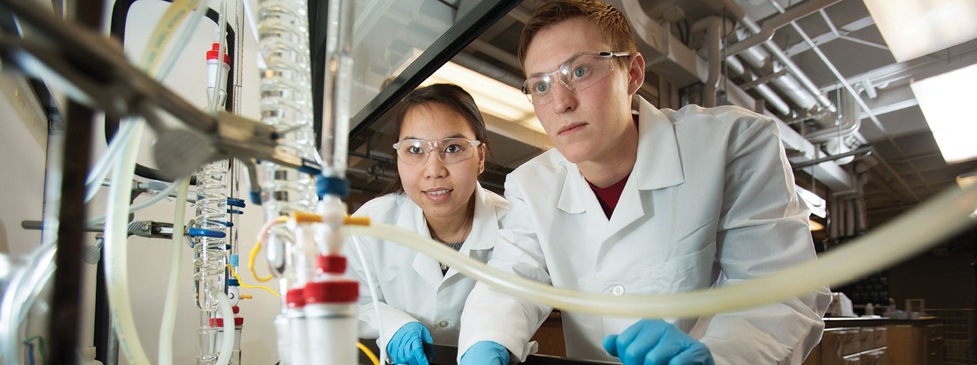 students wearing PPE in chemical engineering lab