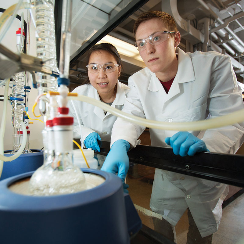 students wearing PPE in chemical engineering lab