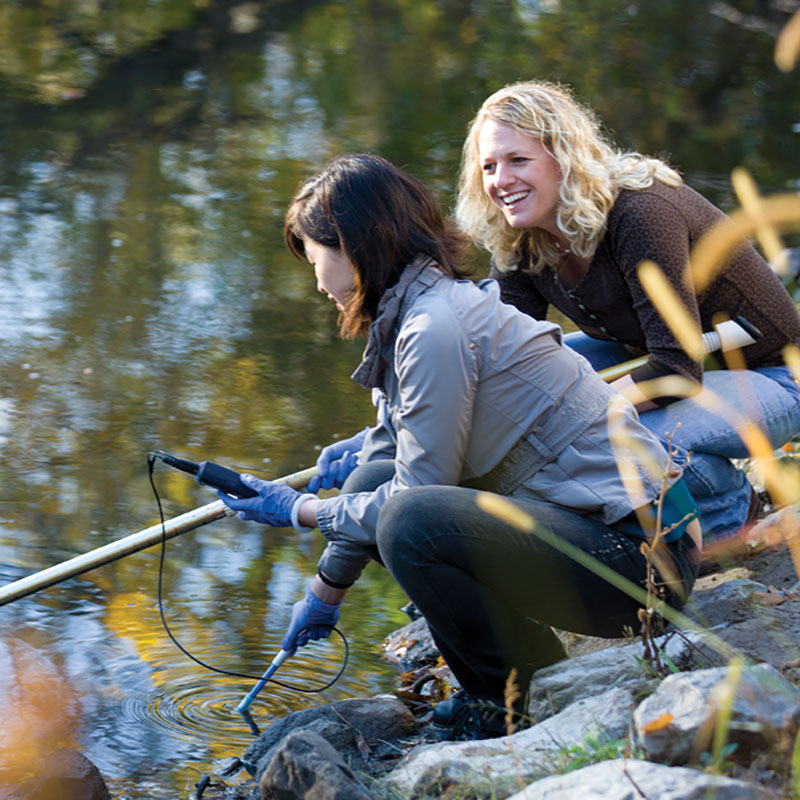 professor and student testing water quality