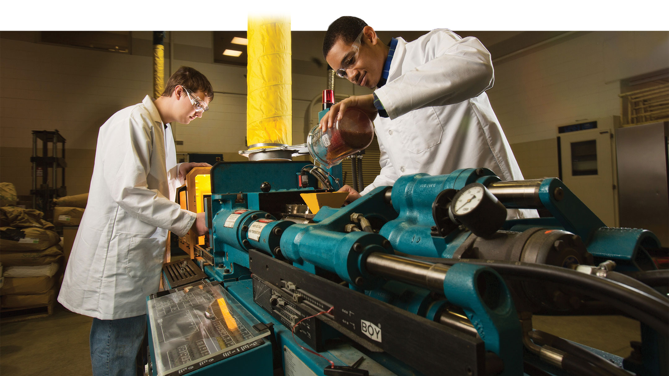 Students work with bioprocessing equipment
