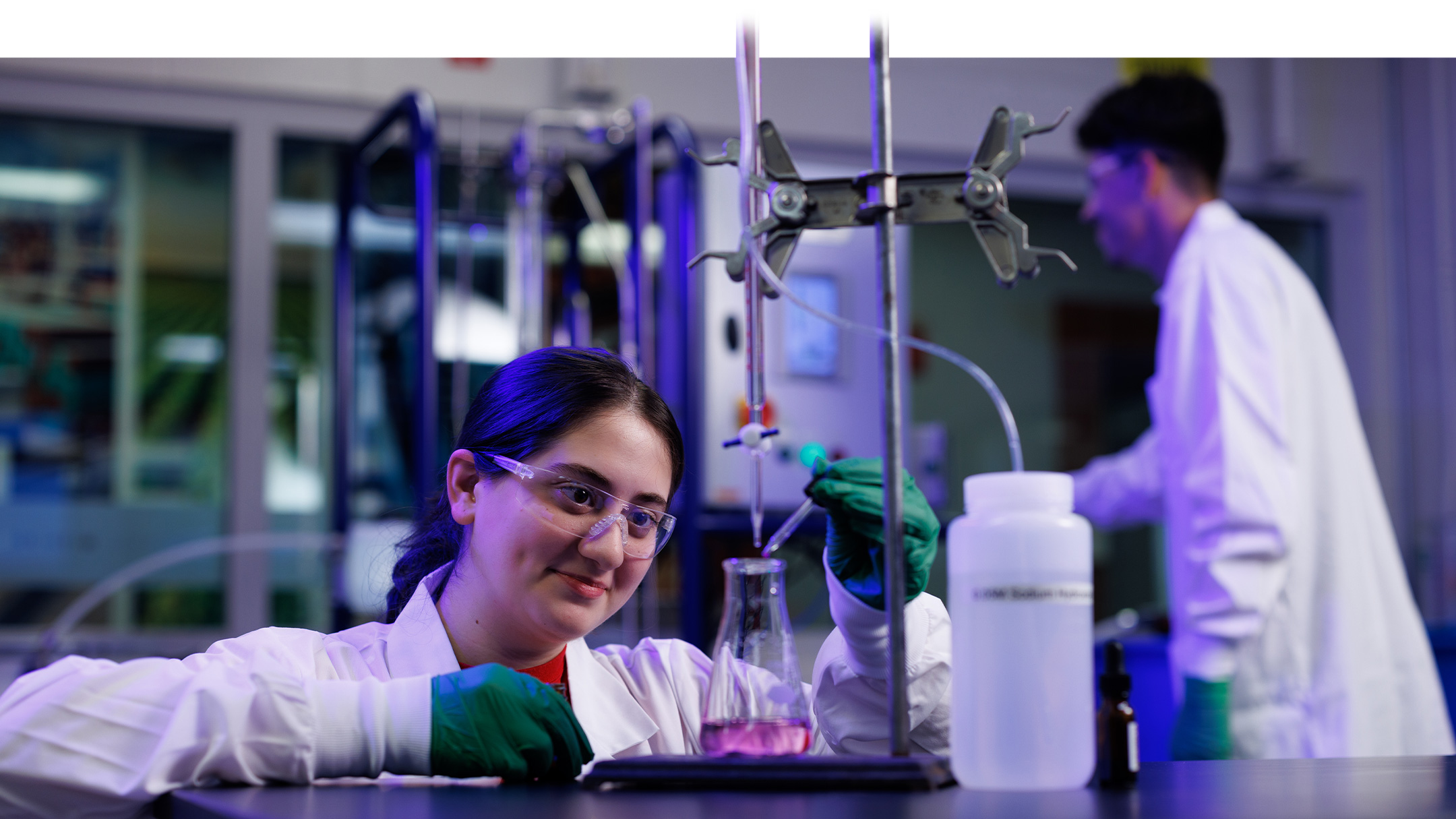Student in the lab conducts an experiment