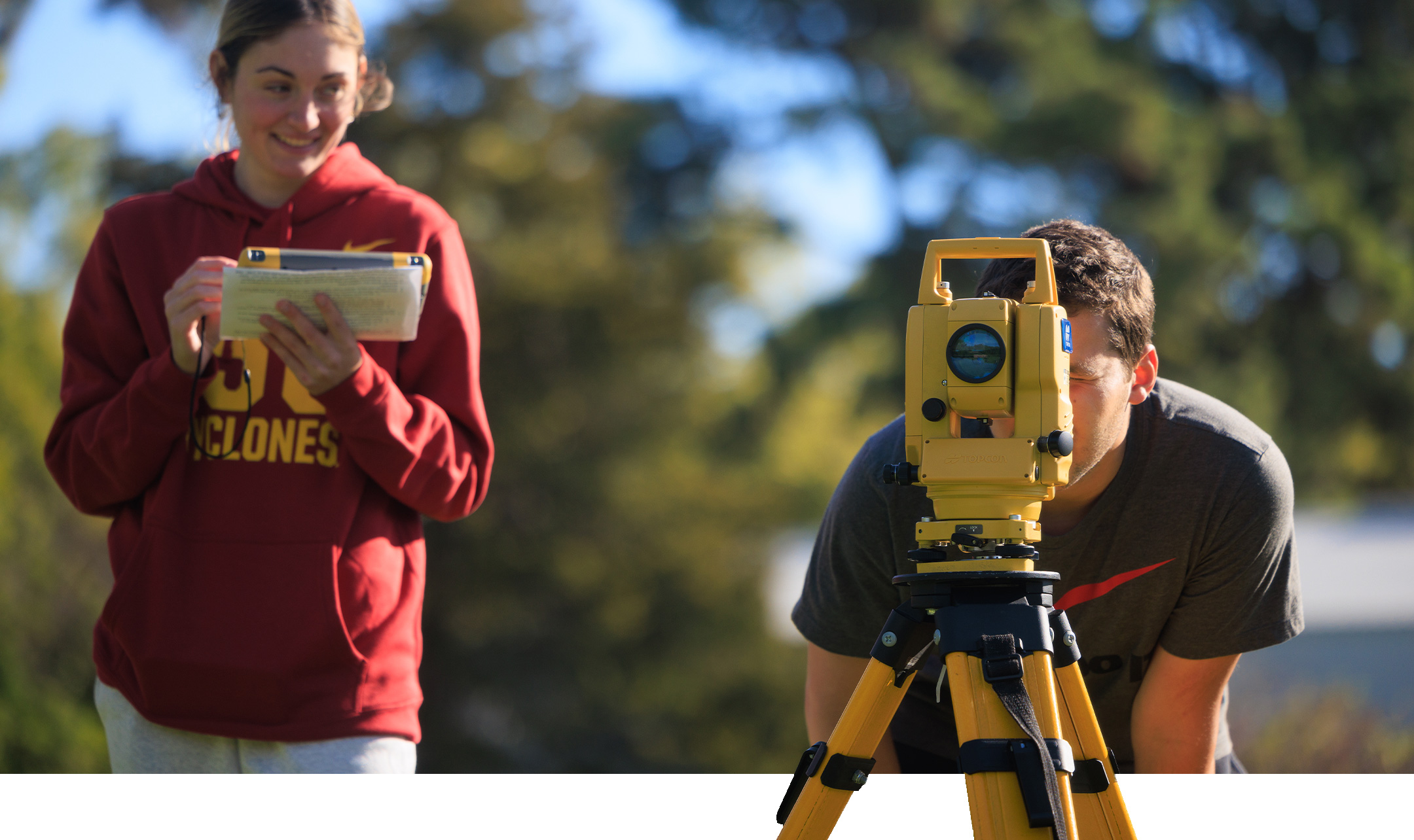 Students work with Land-Surveying equipment