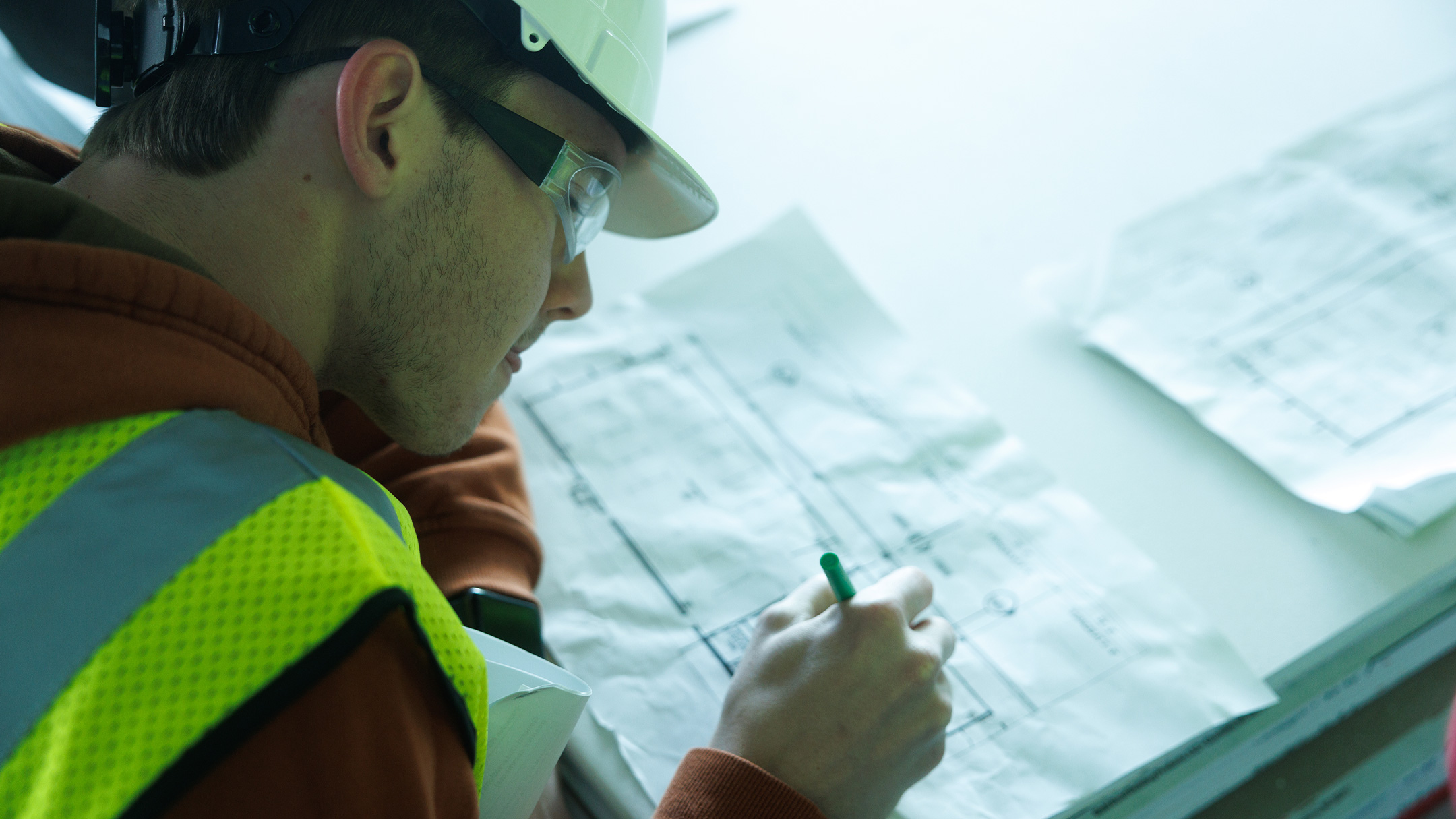 Student focused deeply on floorplans