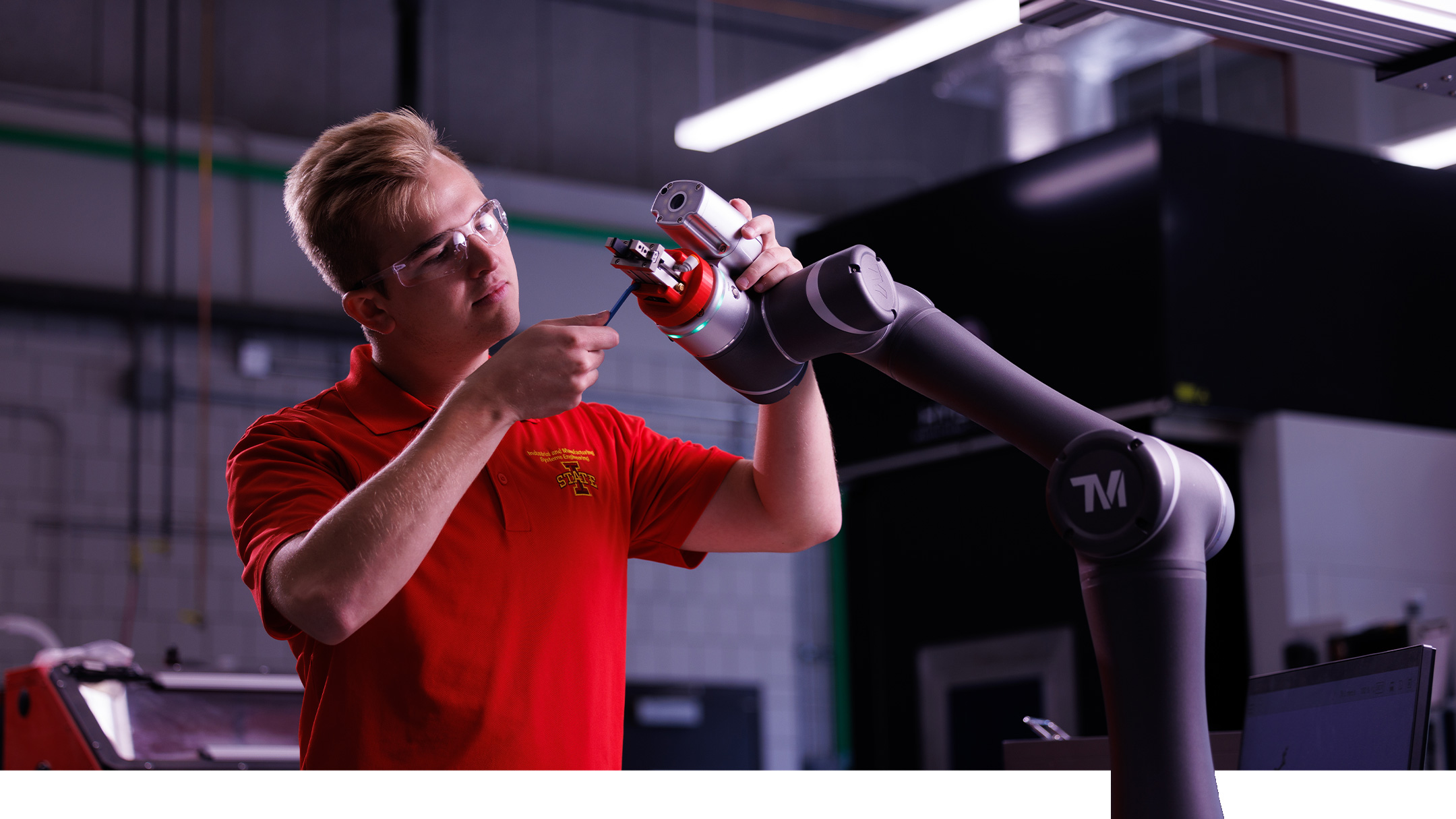 Student adjusts advanced manufacturing technology