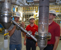 Jordan Funkhouser, Lysle Whitmer and Marty Haverly, left to right, helped redesign and rebuild Iowa State's fast pyrolysis pilot plant. - Photo by Bob Mills of the Bioeconomy Institute
