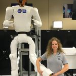 Rozier standing with a NASA robot