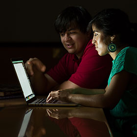 students at laptop