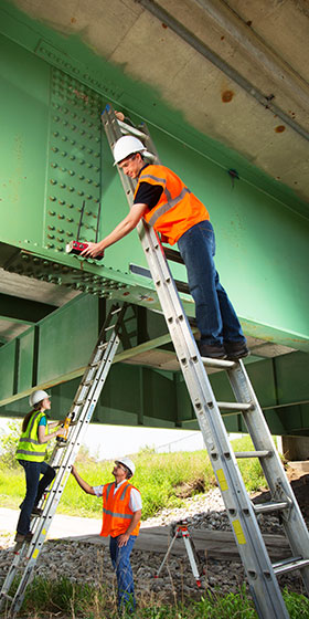 researchers gather data on bridge structure