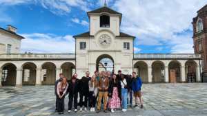 Group stands in front of building in Italy